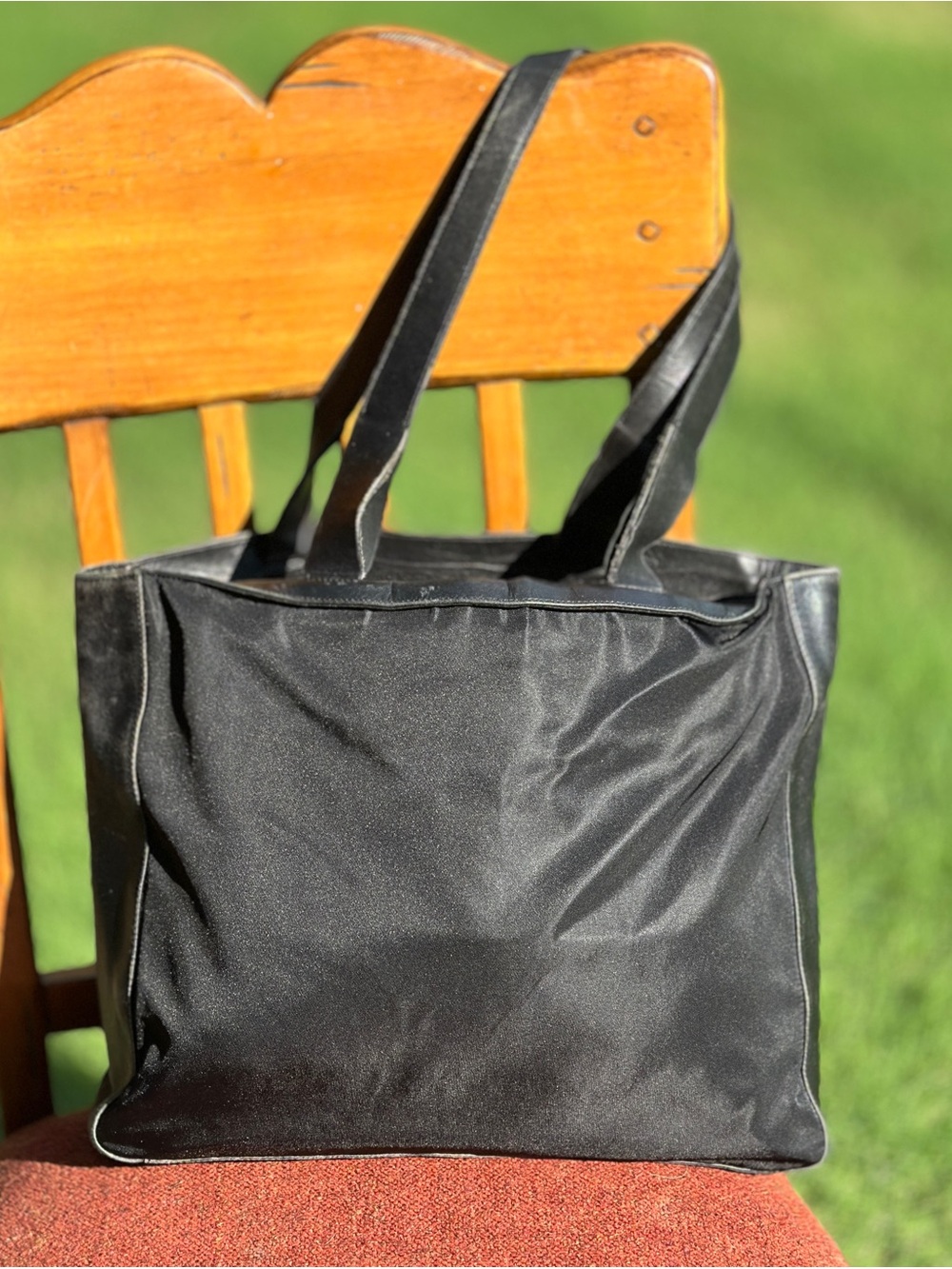 AUTHENTIC Chic black handbag by Prada. Ideal for versatile styling.